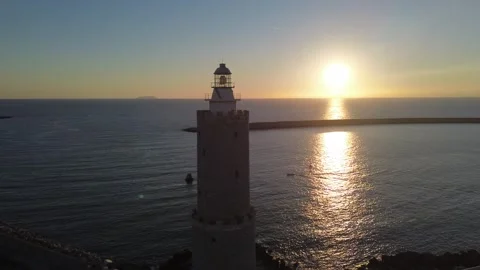 Drone orbit around lighthouse at sunset, Livorno, Italy Stock Footage 345130238