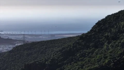 Drone Orbit Around Lush Volcanic Mountain Revealing Distant Coastline Stock Footage 309949195