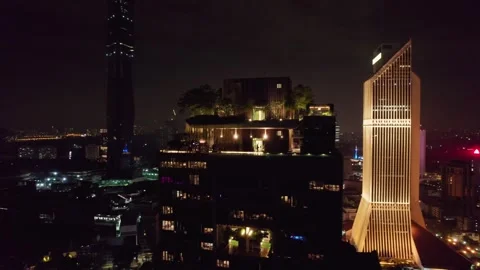 Drone Orbit Around Luxury Rooftop Tower with Merdeka 118 at Night Kuala Lumpur Stock Footage 343699101