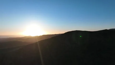 Drone Orbit Around Mountain Revealing Sunset and Blue Sky – Gran Canaria Stock Footage 309943574