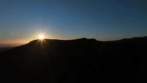 Drone Orbit Around Mountain with Setting Sun Sliding Along Ridge Gran Canaria Stock Footage 309943585