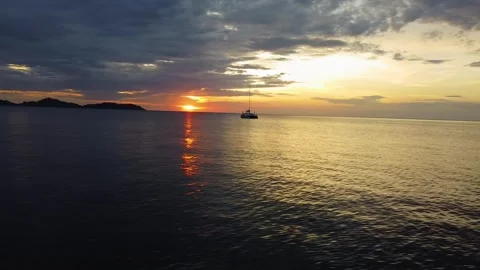 Drone Orbit Around Sailboat at Sunset on Tropical Beach Thailand Stock Footage 331224691
