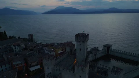 Drone Orbit Around Scaliger Castle Tower at Twilight in Sirmione Stock Footage 314460554