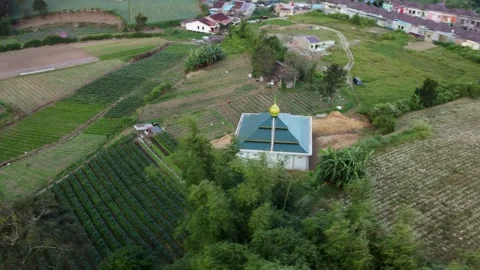 Drone Orbit Around Small Mosque in Farmlands of Berastagi, Sumatra Indonesia Stock Footage 315301141
