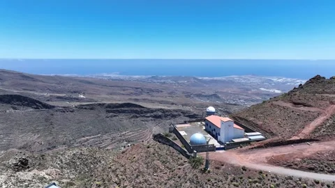 Drone orbit around Temisas Observatory with ocean and coastline view Stock Footage 310683599