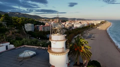 Drone Orbit Around Top of Lighthouse at Sunset, Costa Brava, Spain Stock Footage 319861120