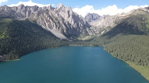 Drone Orbit Around Turquoise Alpine Lake in Cuopu Valley Sichuan China Stock Footage 330279629