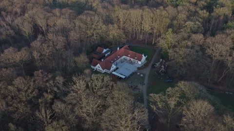 Drone Orbit Around White Forest Café in Bulskampveld Park, Belgium | FlyLens Stockbeeldmateriaal 328238497
