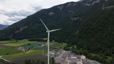 Drone Orbit Around Wind Turbine Above Industrial Quarry Lake Stock Footage 336368465