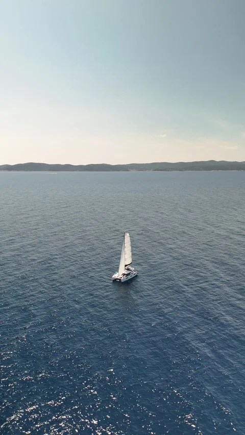 Drone Orbit: Catamaran on Open Adriatic Sea, Vis Island, Croatia Video stock 313483494