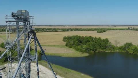 Drone Orbit of Grain Elevator Towers Surrounded by Fields Vídeos de archivo 324690890
