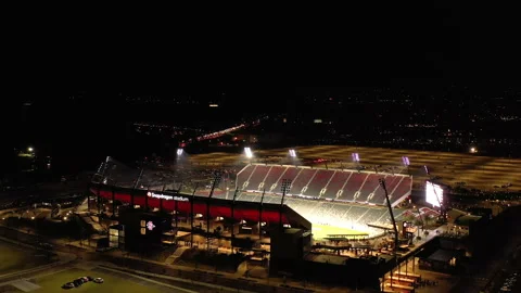 Drone orbit at night around Snapdragon Stadium in Mission Valley, San Diego Stock Footage 228594657