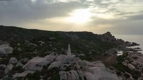 Drone Orbit Over Calm Sea Reflecting Sunset Near Lighthouse Sardegna Vídeo Stock 333516300