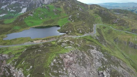 Drone orbit over a mountain lake and the Slieve League cliffs, Ireland Stock Footage 346746319