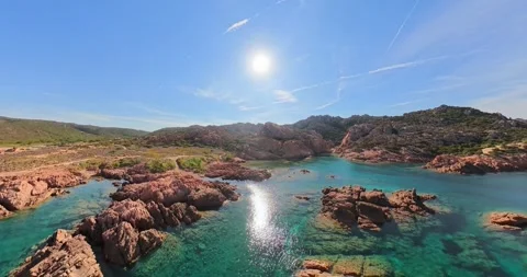 Drone orbit over rugged granite cliffs and secluded turquoise bays 스톡 동영상 347902260