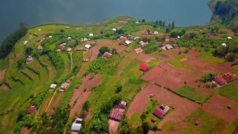 Drone Orbit Over Rural Hillside Settlement Near Lake Bunyonyi, Uganda Stock Footage 313971455