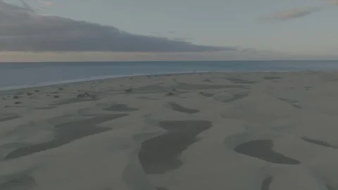 Drone Orbit Over Sand Dunes with Ocean and Dramatic Sky – Gran Canaria Stock Footage 309951240