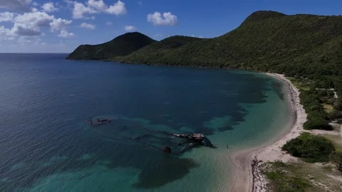 Drone orbit over shipwreck - St Kitts Major's Bay Stock Footage 325752195