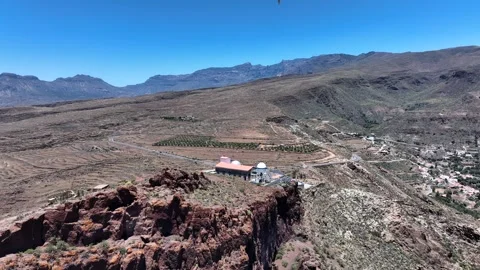 Drone orbit over Temisas Observatory with bird flying and village view Stock Footage 310683151