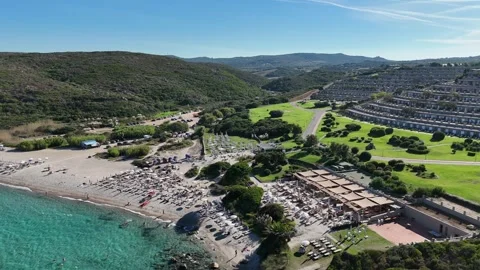 Drone Orbit Over Turquoise Waters and Sandy Beach on a Sunny Day Vídeo Stock 334127799