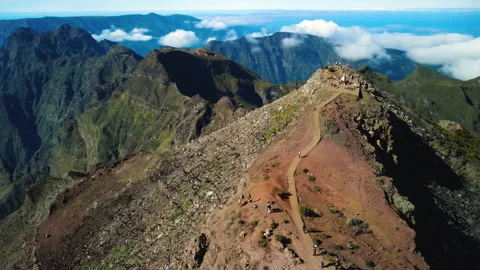 Drone orbit of Pico Ruivo summit and hikers on PR1.2 trail, Madeira Vídeos de archivo 328640554