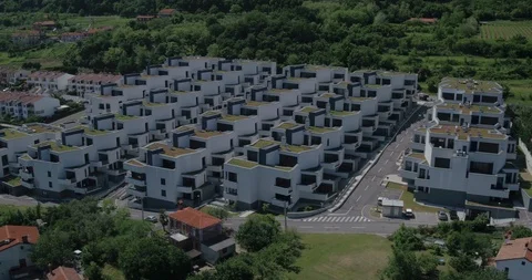 Drone Orbit Reveal Of Modern Complex In Peaceful Neighborhood Stock Footage 124315478