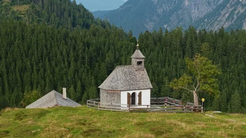 Drone orbit right of Postalmkapelle chapel and alpine hut at Postalm, Austria Stock-Footage 337309367
