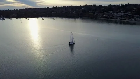 Drone orbit of a sailboat in sunset Stock Footage 72648887
