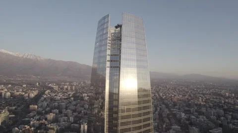 Drone Orbit Shot Around Gran Torre Santiago Revealing Andes Mountains Stock Footage 345606536