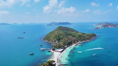 Drone orbit shot around a white sandbar in a turquoise island bay 4K Stock Footage 333938984