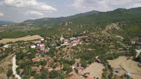 Drone orbit shot of Cide coastal town with mosque and traditional houses Stockbeeldmateriaal 334959184