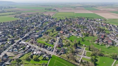 Drone orbit of small German town with houses and rural landscape Stock Footage 333867561