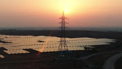 Drone-orbit-transmission-tower-solar-farm-sunset-renewable-energy Stock Footage 342804328