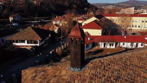 Drone orbit view of  bell tower in Tryavna, Bulgaria, lit with the afternoon sun Video stock 151386428