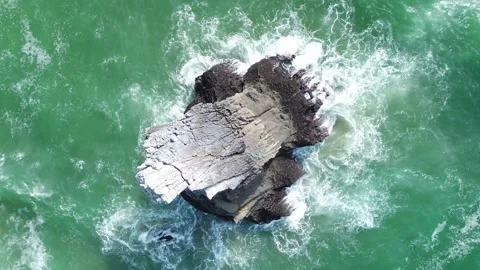 A drone orbital over a sharp rock on the Atlantic coast  Stock Footage 289663787
