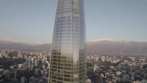 Drone Orbiting Around Costanera Center Revealing Snow Capped Mountains Stock Footage 345606532