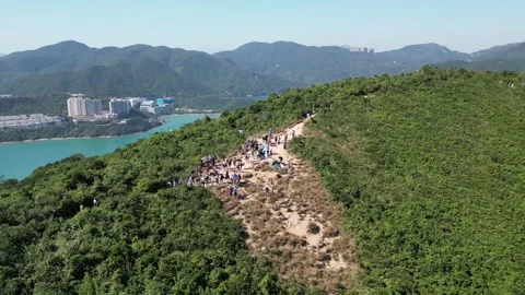 Drone Orbiting Around Hikers at Dragon's Back, Hong Kong Stock Footage 303283215