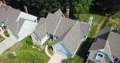 Drone Orbiting Around New Pattern Roof on Home in the Suburbs Stock Footage 202095357