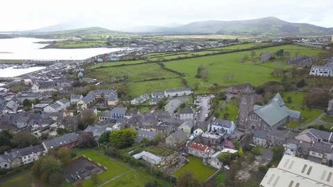 Drone Orbiting Around Small Town and Church in Dingle, Ireland Stock Footage 89151279