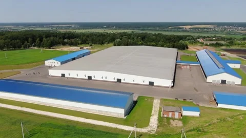 Drone orbiting modern farm facility in countryside Stock-Footage 333278272