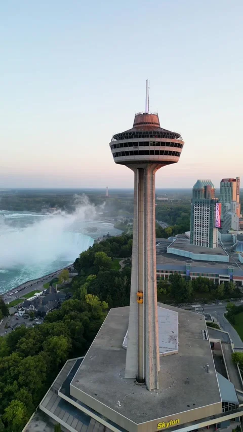 Drone Orbiting Skylon Tower with Niagara Falls Visible in Background, Ontario, Video stock 330450812