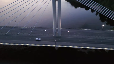 Drone orbiting traffic on the Lumberjack's Candle Bridge, summer dusk in Stock Footage 338157111