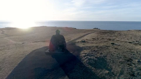 Drone Orbiting the Troll Statue at Arnarstapi in Iceland in 4K Stock Footage 89153295