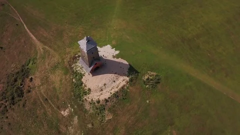 Drone orbiting a watchtower in 4K Stock Footage 102715577