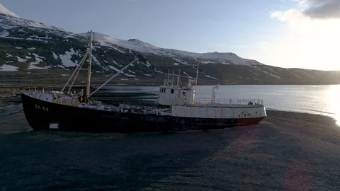 Drone Orbiting Wrecked Ship in Iceland in 4K Stock Footage 89431407