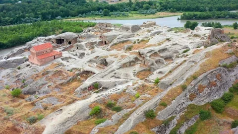 Drone orbits above Uplistsikhe rock city in Georgia, revealing cave chambers, a Stock Footage 340764350