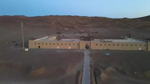 Drone Orbits Desert Fortress from Front, Counter-Clockwise at Dusk Video stock 327830468