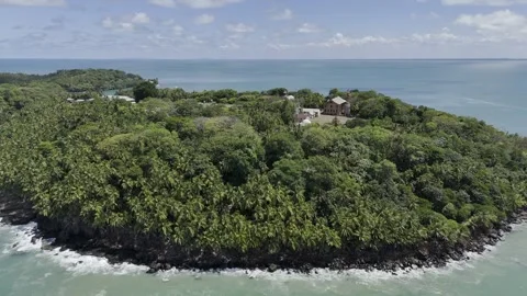 Drone orbits as it rises over Royal Island for a view of Devil's Island Stock Footage 289245245