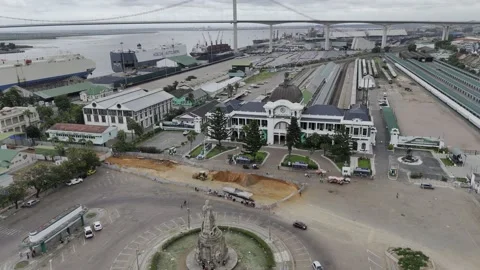 Drone orbits left in front of train station at Worker's Square Stock Footage 333841791