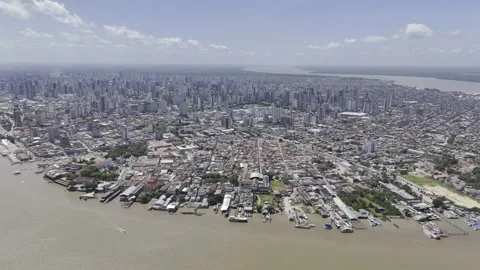 Drone orbits to the left high over downtown Belém on sunny afternoon Vídeos de archivo 284459896